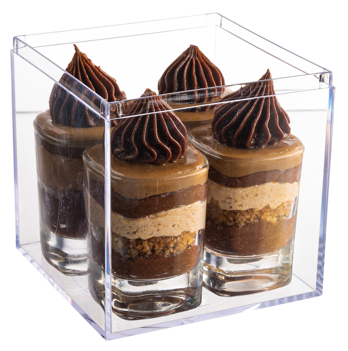 A set of six dessert glasses featuring layers of caramel mousse, chocolate ganache, and whipped topping, beautifully displayed in a clear gift box with The Nuttery branding