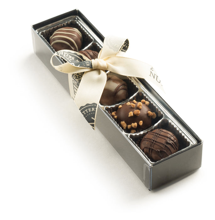 Enjoy a premium selection of handcrafted dairy chocolate truffles from The Nuttery. Packed in a sophisticated black gift box, it’s the perfect chocolate lover’s gift.