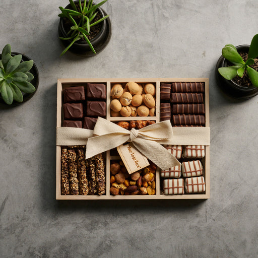 Gourmet delight gift tray from The Nuttery NY, featuring an elegant assortment of premium chocolates, roasted nuts, and handcrafted confections, beautifully arranged in a wooden gift box with a customizable ribbon.