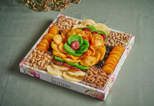 A beautifully arranged assortment of dried fruits, roasted nuts, and gourmet snacks, designed in a floral pattern. This luxury snack tray is a healthy, delicious, and visually stunning gift for any occasion.