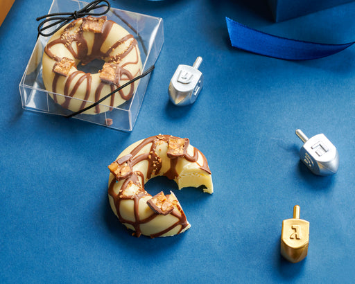 Savor the smooth, velvety taste of chocolate and cheese in this gourmet donut, beautifully packaged for gifting. A delicious twist on classic holiday treats.