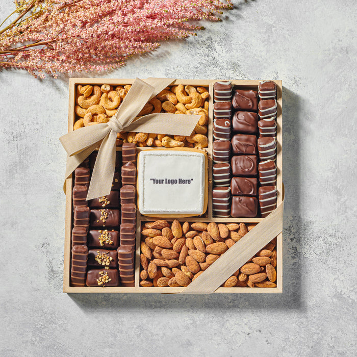 The Nuttery NY square custom logo gift tray, featuring an assortment of premium chocolates, roasted almonds, and cashews, elegantly arranged with a customizable chocolate plaque for corporate gifting.