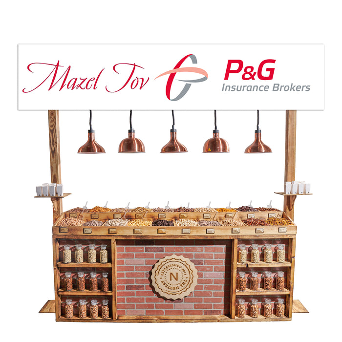 A fully stocked rustic nut station from The Nuttery, set against a white background, featuring warm lighting and an extensive nut selection