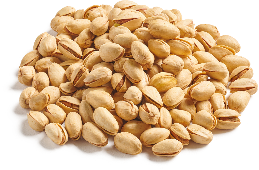 A pile of roasted and salted pistachios with golden shells, emphasizing their crunchy texture and savory flavor, displayed on a white background