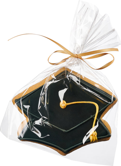 A classic black mortarboard cap-shaped sugar cookie with a gold tassel, elegantly packaged for graduation celebrations.