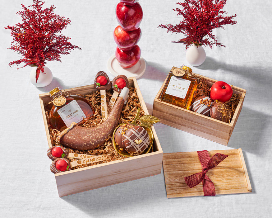 The Nuttery Shana Tova Specialty Platter – a luxurious assortment of handcrafted chocolate-dipped treats, chewy fruit jellies, and crisp dried fruits, artfully displayed with a decorative holiday cookie in a sophisticated gift box.