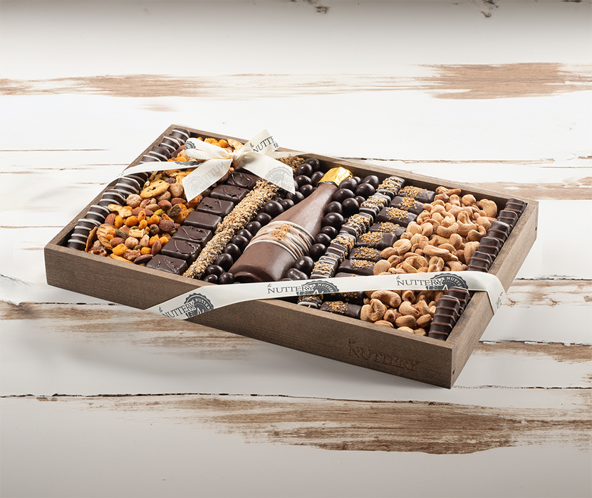 A beautifully arranged Purim chocolate and nut gift tray, filled with premium sweets and roasted nuts. Thoughtfully curated for a festive and delicious experience.