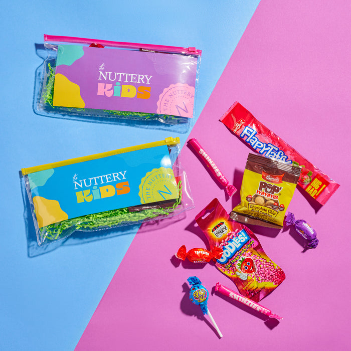 Bright, fun, and packed with sweet surprises, The Nuttery Kids pouch is the ultimate candy gift. Bursting with colorful treats, it’s a delightful snack pack for kids of all ages.