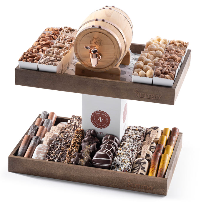 This unique barrel-themed gift tower includes an exquisite selection of handcrafted chocolates, roasted nuts, and gourmet snacks, making it a perfect centerpiece for gifting or celebrations