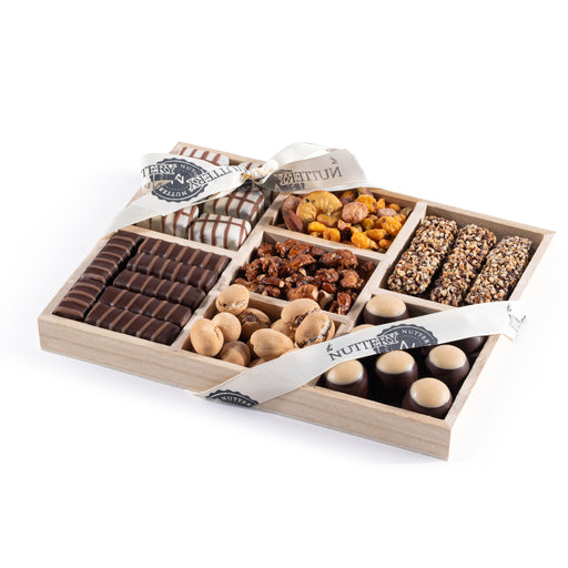 A sophisticated selection of rich chocolates, crunchy nuts, and candied delights. This elegantly packaged gift tray is ideal for sharing and celebrating special moments.