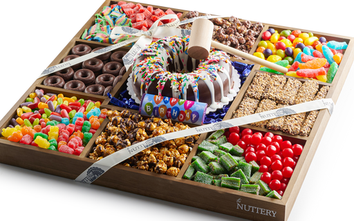 Colorful Nuttery Mega Birthday Gift Tray featuring a variety of chocolates, candies, sour treats, gourmet popcorn, and a smash cake centerpiece with a hammer for birthday celebrations.