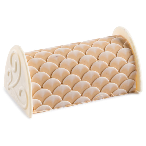 A decadent chocolate peanut butter log with a delicate wave pattern and white chocolate detailing. This gourmet treat blends rich flavors with an artful presentation.