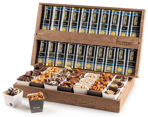 A grand wooden box filled with an assortment of gourmet chocolates, nuts, and spiced treats, paired with a full set of Shas books for an elegant and meaningful gift