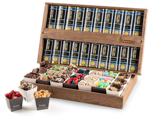 A grand wooden box filled with assorted gourmet chocolates, nuts candy, and spiced treats, paired with a full set of Shas books for an elegant and meaningful gift arrangement