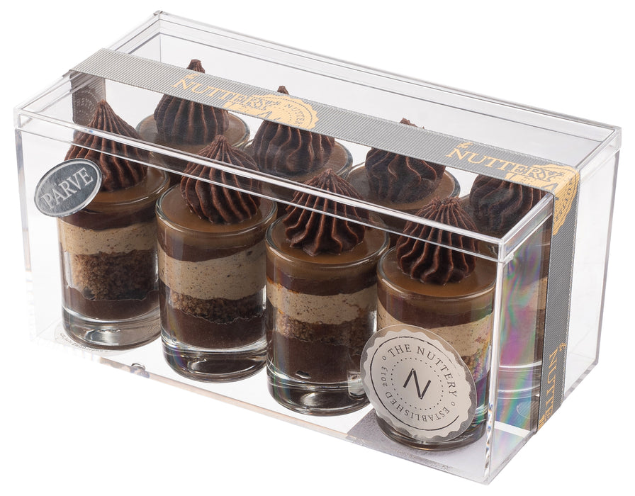 A set of six dessert glasses layered with strawberry mousse, graham cracker crumbs, and whipped cream, elegantly packaged in a clear gift box with The Nuttery branding