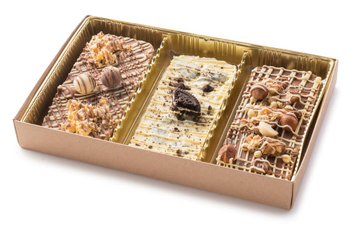 A luxurious set of three handcrafted chocolate tarts from The Nuttery, featuring decadent toppings such as nuts, cookies, and drizzled chocolate, elegantly arranged in a golden gift box.