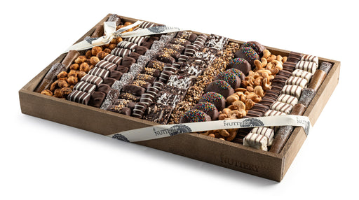 A luxurious assortment of gourmet chocolates, nuts, and halva elegantly arranged in a premium wooden gift tray, tied with The Nuttery’s signature ribbon.