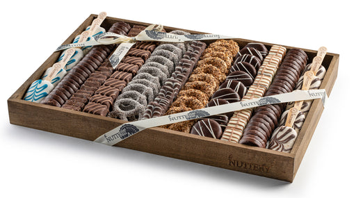 Gourmet Nuttery chocolate and halva gift tray with handcrafted sweets and dipped confections. A luxurious selection of premium chocolates, halva bites, and artisanal treats arranged beautifully for gifting.