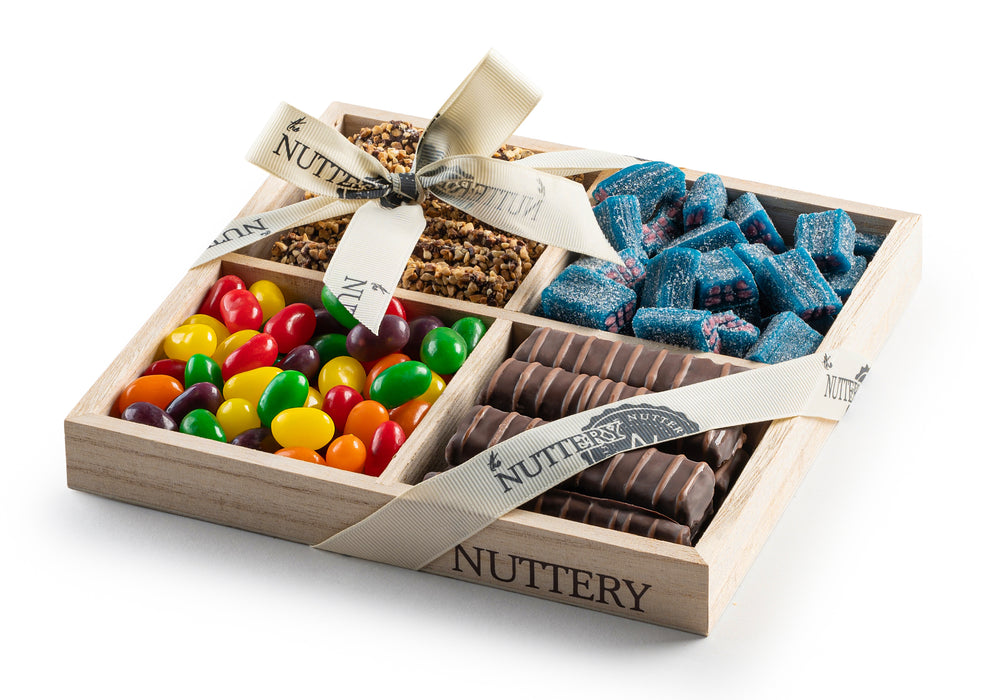 Enjoy a delightful mix of premium chocolates, candies, and gourmet treats in this elegant four-section gift tray. A perfect balance of sweetness and crunch for any occasion.