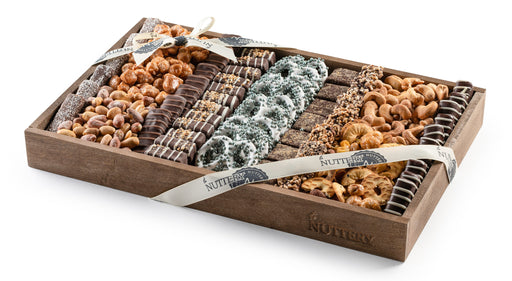 A gourmet chocolate and nut gift tray from The Nuttery, featuring chocolate-dipped pretzels, premium nuts, and halva confections, beautifully arranged for elegant gifting.