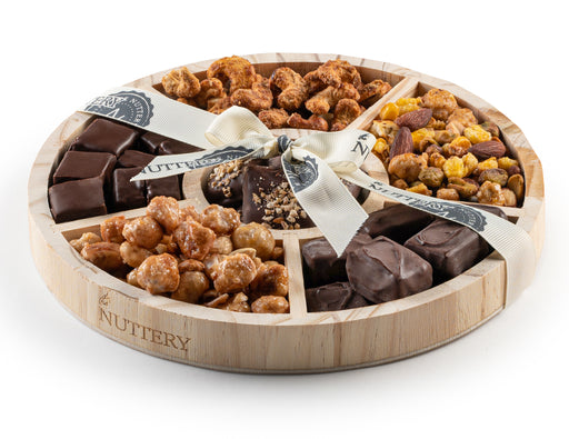 A grand assortment of chocolate-dipped treats, roasted nuts, and artisanal confections. This luxurious gift tray is designed to impress and satisfy every sweet and savory craving.