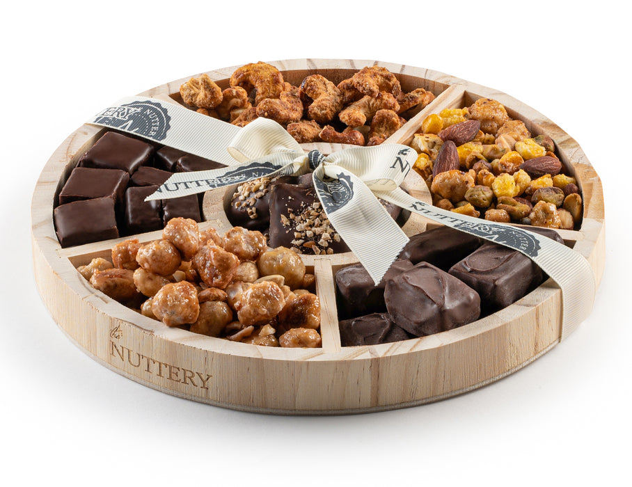 A grand assortment of chocolate-dipped treats, roasted nuts, and artisanal confections. This luxurious gift tray is designed to impress and satisfy every sweet and savory craving.