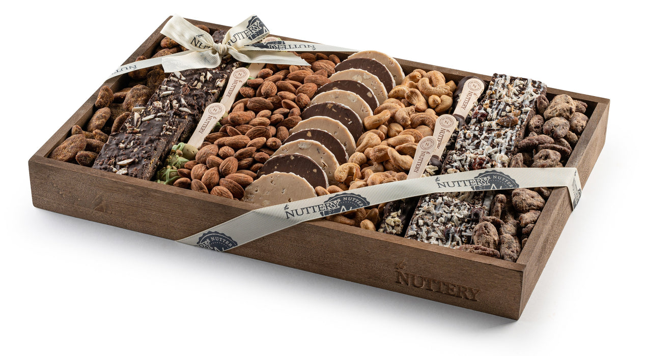 A moderate size of gourmet selection of rich chocolates, roasted nuts, and crunchy confections in a wooden tray. Tied with an elegant ribbon, this gift is perfect for any occasion.