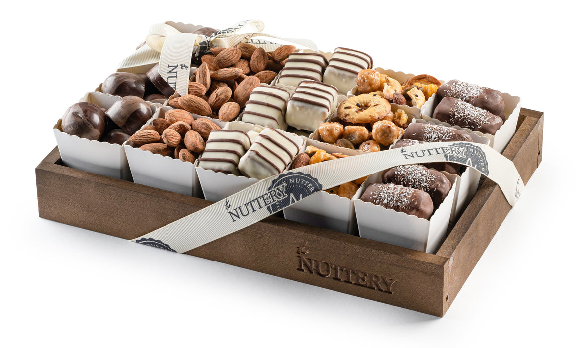 A beautifully arranged gift tray with individual cups of gourmet chocolates, nuts, and confections. Perfect for sharing, this elegant assortment makes a thoughtful and delicious gift.