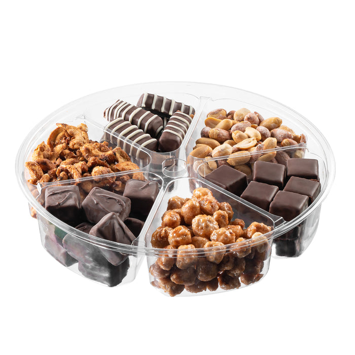 The Nuttery NY chocolate and nut gift tray with six sections, featuring an assortment of chocolate-covered treats, roasted nuts, and gourmet confections, elegantly packaged in a clear plastic container.