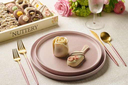 Elevate your dessert table with The Nuttery’s exquisite cheese roses, a luxurious treat for special occasions. Paired with gourmet sweets, they offer a feast for the eyes and taste buds.