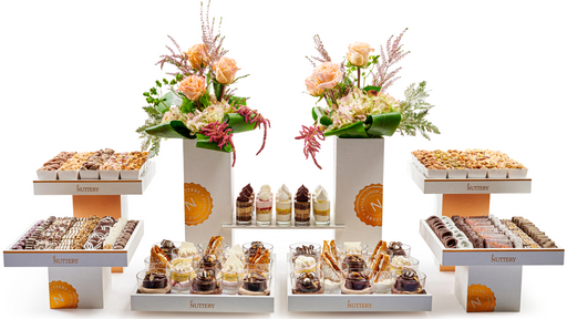 An opulent wedding tower arrangement showcasing artisanal chocolates, gourmet nuts, and luxurious floral décor—perfect for making a grand statement at any event