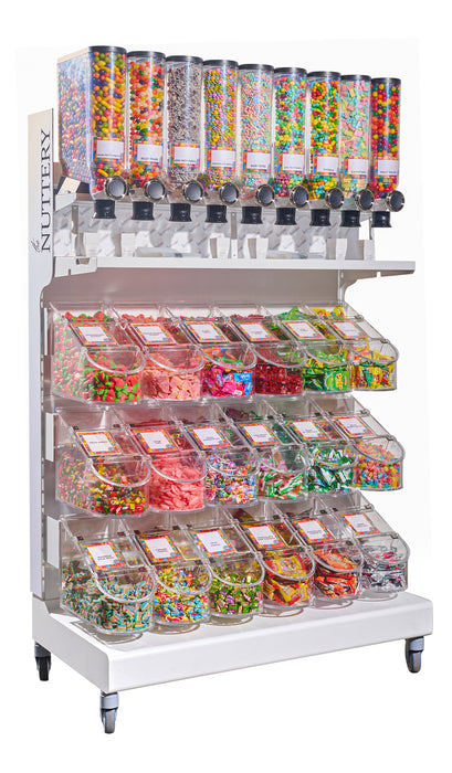 Candy display rack with dispensers and bins filled with colorful sweets, including jelly beans and chocolate lentils.