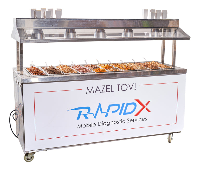 A commercial-grade warming nut cart from The Nuttery, equipped with multiple trays of warm nuts and a clean, professional design.
