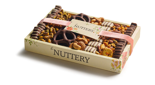 A compact yet elegant gift tray filled with premium chocolates, roasted nuts, and gourmet confections. Perfect for celebrations, this artisanal assortment is wrapped with a stylish ribbon.