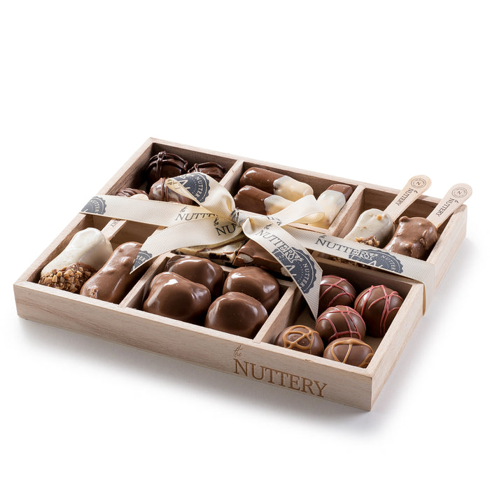 A delightful chocolate gift tray featuring a mix of pops, truffles, and turtles. A great choice for a thoughtful and delicious gift.